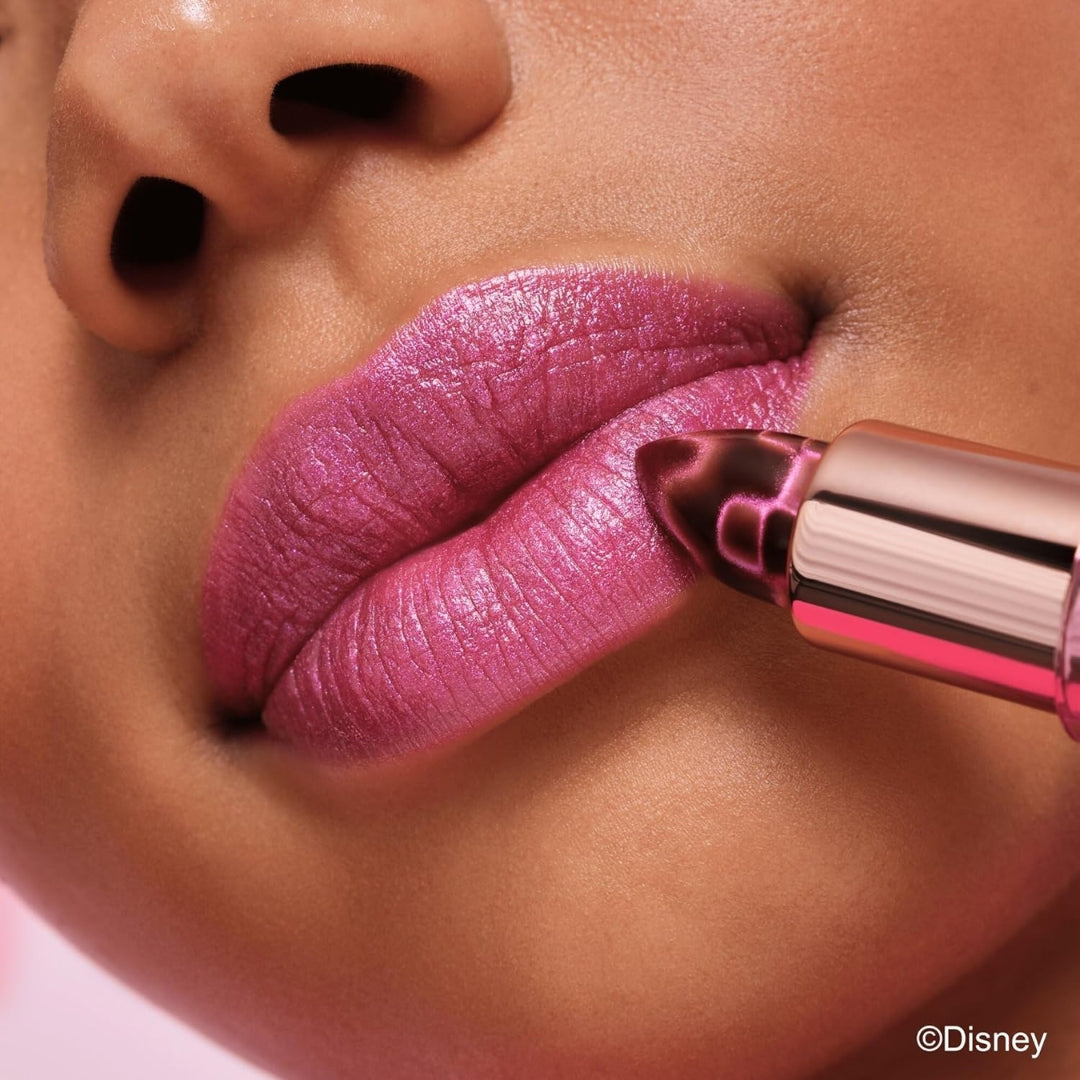 Close-up of a person applying Essence Disney Alice in Wonderland lip glow