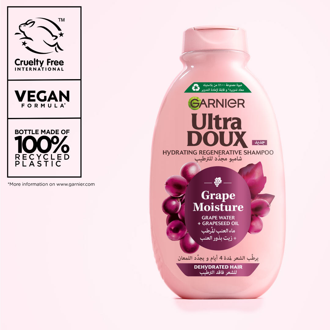 Garnier Ultra Doux Grape Moisture shampoo bottle with branding and sustainability information on a white background