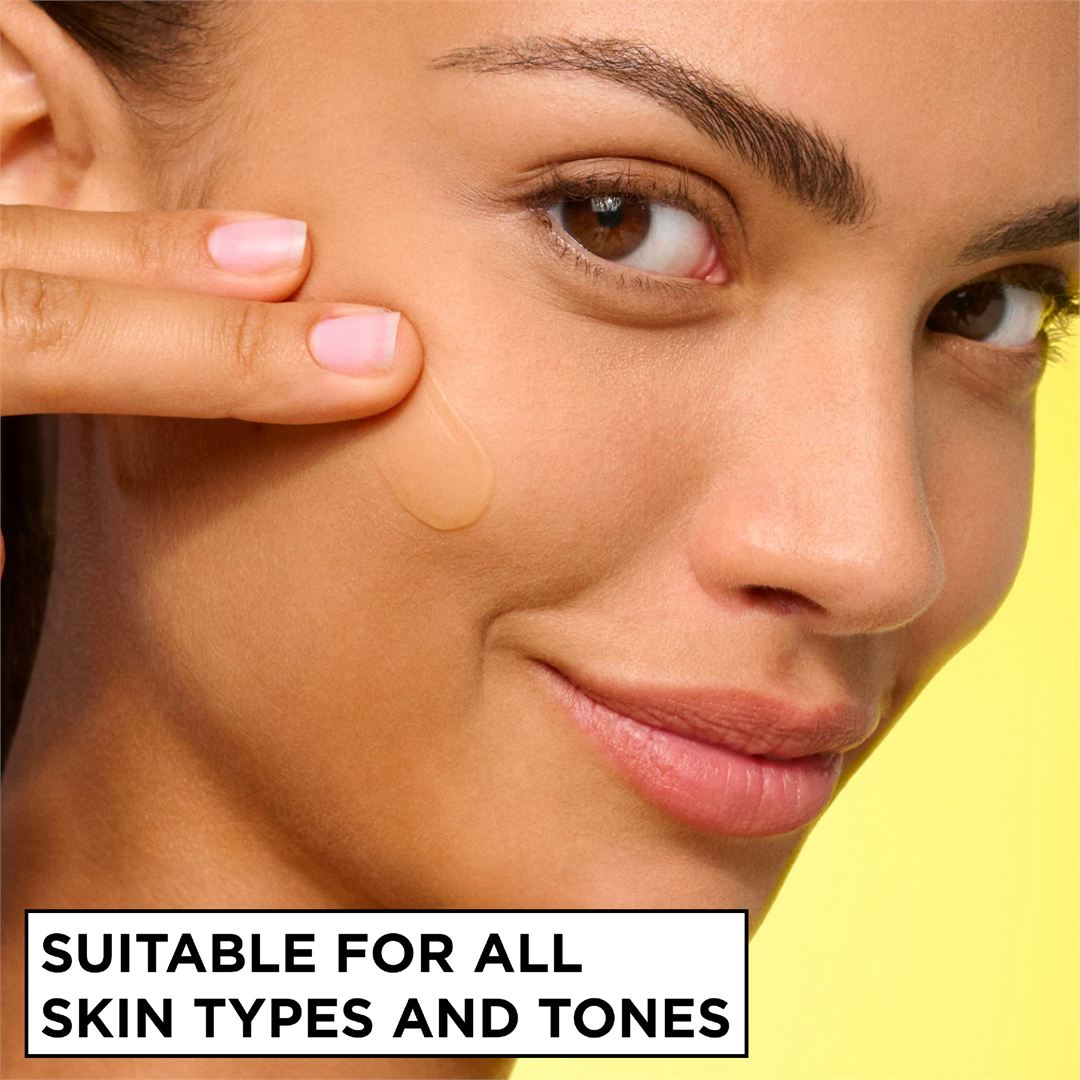 Close-up of a woman's face with a clear gel patch applied to her cheek, with text at the bottom reading 'SUITABLE FOR ALL SKIN TYPES AND TONES' against a bright yellow background.